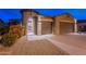 Attractive single-story home with two-car garage and desert landscaping at 26063 N 83Rd Dr, Peoria, AZ 85383