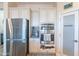 Modern kitchen with stainless steel appliances and a pantry at 26063 N 83Rd Dr, Peoria, AZ 85383