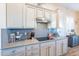 Kitchen with modern cabinetry and sleek countertops at 26063 N 83Rd Dr, Peoria, AZ 85383