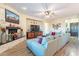 Relaxing living room with sectional sofa and large TV at 26063 N 83Rd Dr, Peoria, AZ 85383