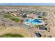 Community pool and clubhouse with desert landscape and mountain views at 26458 W Yukon Dr, Buckeye, AZ 85396