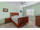 Charming bedroom with wooden bed frame and window shutters at 26458 W Yukon Dr, Buckeye, AZ 85396