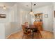 Charming dining area with wood table and chairs, built-in hutch, and window at 26458 W Yukon Dr, Buckeye, AZ 85396