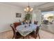 Casual dining area with sliding door access to the patio and pool at 26458 W Yukon Dr, Buckeye, AZ 85396