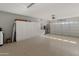 Spacious garage with ample storage and epoxy flooring at 26458 W Yukon Dr, Buckeye, AZ 85396