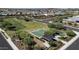 Aerial view of community amenities including a park, basketball court, and playground at 30401 N 115Th Dr, Peoria, AZ 85383