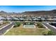 Aerial view showing neighborhood homes and community basketball court at 30401 N 115Th Dr, Peoria, AZ 85383