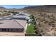 Aerial view of house, backyard, and neighborhood, showcasing the landscape at 30401 N 115Th Dr, Peoria, AZ 85383