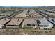 Aerial view of community, showing numerous homes and landscape at 30401 N 115Th Dr, Peoria, AZ 85383