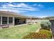 Spacious backyard with patio, grass, and flowers at 30401 N 115Th Dr, Peoria, AZ 85383