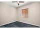 Bright bedroom featuring window blinds and plush carpeting at 30401 N 115Th Dr, Peoria, AZ 85383