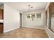 Bright dining room with tile floors and chandelier at 30401 N 115Th Dr, Peoria, AZ 85383