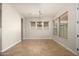 Bright dining room with tile floors and chandelier at 30401 N 115Th Dr, Peoria, AZ 85383