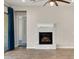 Modern fireplace with white stone surround at 30401 N 115Th Dr, Peoria, AZ 85383