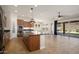 Kitchen with island, stainless steel appliances, and wood cabinets at 30401 N 115Th Dr, Peoria, AZ 85383