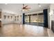 Living room with tile floors, fireplace, and access to backyard at 30401 N 115Th Dr, Peoria, AZ 85383