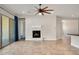 Living room with fireplace and view to backyard at 30401 N 115Th Dr, Peoria, AZ 85383