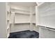 Large walk-in closet with ample shelving and hanging space at 30401 N 115Th Dr, Peoria, AZ 85383