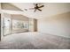 Bright and airy bedroom with vaulted ceiling, ceiling fan, carpet, and a private entrance at 30626 N 45Th Pl, Cave Creek, AZ 85331