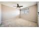 Bedroom with neutral carpet, ceiling fan, and a window at 30626 N 45Th Pl, Cave Creek, AZ 85331