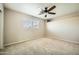 Bedroom with carpet, ceiling fan, and a window for natural light at 30626 N 45Th Pl, Cave Creek, AZ 85331