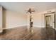 Spacious bedroom with ceiling fan, hardwood floors, and an arched doorway leading to the bathroom at 30626 N 45Th Pl, Cave Creek, AZ 85331