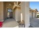 Covered front porch featuring stucco columns and a decorative flower pot at 30626 N 45Th Pl, Cave Creek, AZ 85331