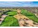 Scenic aerial of golf course showcasing green fairways, sand traps, and picturesque desert surroundings at 30626 N 45Th Pl, Cave Creek, AZ 85331