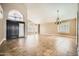 Open living area featuring elegant tile flooring, high ceilings, and an arched doorway at 30626 N 45Th Pl, Cave Creek, AZ 85331