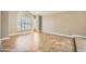 Spacious living room featuring tile floors, neutral walls, and bright natural light from large window with white shutters at 30626 N 45Th Pl, Cave Creek, AZ 85331