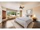 Serene bedroom with abundant natural light and a relaxing sitting area by the windows at 30626 N 45Th Pl, Cave Creek, AZ 85331