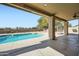 Covered patio with a pool and spiral staircase leading to a second-story balcony at 30626 N 45Th Pl, Cave Creek, AZ 85331