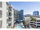 Modern building with pool and surrounding cityscape view at 3131 N Central Ave # 6015, Phoenix, AZ 85012