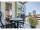 Urban balcony with table and chairs, offering city views at 3131 N Central Ave # 6015, Phoenix, AZ 85012