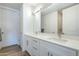 Modern bathroom with double vanity, quartz countertops, and elegant fixtures at 3131 N Central Ave # 6015, Phoenix, AZ 85012