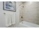 Bright bathroom with bathtub, shower, and neutral tile at 3131 N Central Ave # 6015, Phoenix, AZ 85012