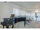 Bright dining area with a round table and four chairs, situated near a grand piano at 3131 N Central Ave # 6015, Phoenix, AZ 85012