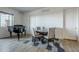 Modern condo dining area featuring a round table and four light-grey chairs at 3131 N Central Ave # 6015, Phoenix, AZ 85012