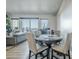 Open concept living room and dining area with hardwood floors and city views at 3131 N Central Ave # 6015, Phoenix, AZ 85012