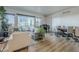 Modern living room with gray sofa and city views, adjacent to a dining area at 3131 N Central Ave # 6015, Phoenix, AZ 85012