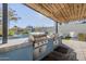 Outdoor kitchen with two grills and wood pergola at 3131 N Central Ave # 6015, Phoenix, AZ 85012