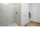 Large shower with glass enclosure and neutral tile at 3131 N Central Ave # 6015, Phoenix, AZ 85012