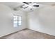 Bright bedroom with carpeted floor and ceiling fan at 3167 E Battala Ct, Gilbert, AZ 85297