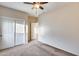 Bedroom with double door closet and ceiling fan at 3167 E Battala Ct, Gilbert, AZ 85297