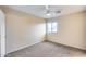 Bright bedroom with carpeted floor, ceiling fan, and window with blinds at 3167 E Battala Ct, Gilbert, AZ 85297