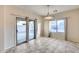 Bright dining room with sliding glass door to backyard at 3167 E Battala Ct, Gilbert, AZ 85297