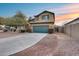 Two-story house with a green garage door and landscaping at 3167 E Battala Ct, Gilbert, AZ 85297