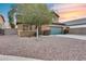 Two-story house with a green garage door and landscaping at 3167 E Battala Ct, Gilbert, AZ 85297