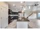 Modern kitchen with dark cabinetry and granite island at 3167 E Battala Ct, Gilbert, AZ 85297