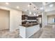 Modern kitchen with dark cabinetry and granite island at 3167 E Battala Ct, Gilbert, AZ 85297